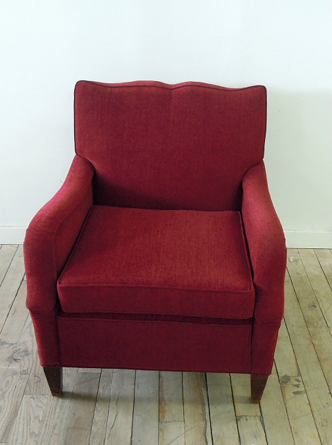 Armchair reupholstered in red fabric