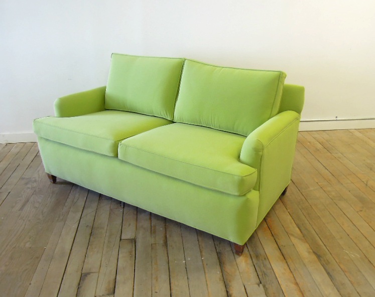 Loveseat reupholstered in green fabric